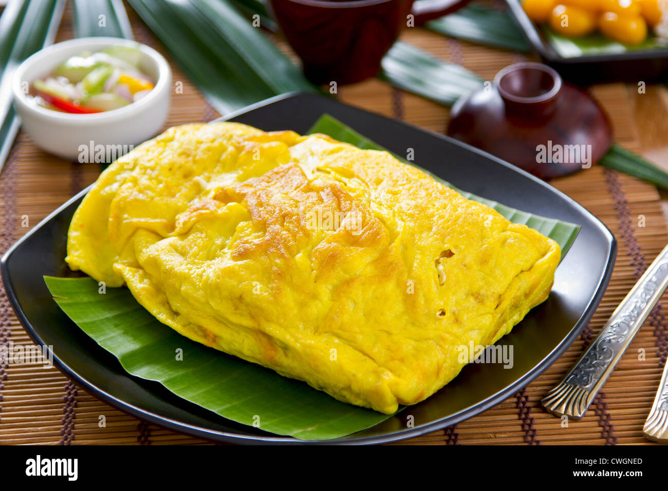 Stir fried bean sprout,tofu,coconut wrapped in omelet [Thai 's cuisine