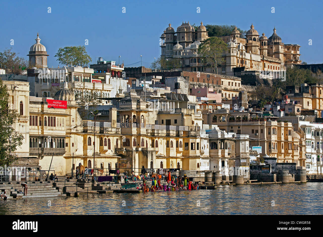 Women bathing in the Ahar River in the city of Udaipur / City of Lakes, Rajasthan, India Stock Photo