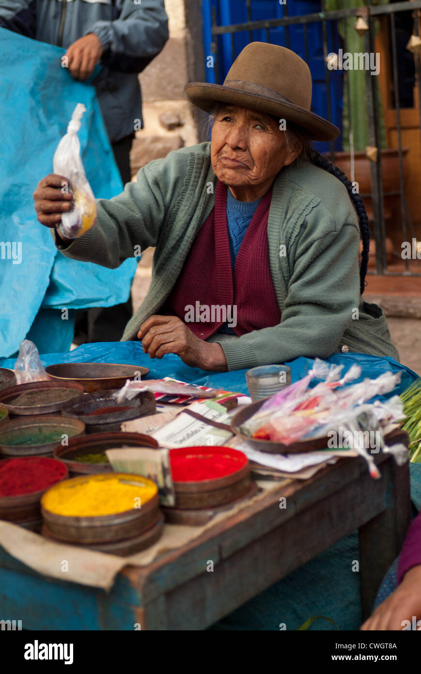 Peruvian women selling dye in Pisac market, Peru Stock Photo
