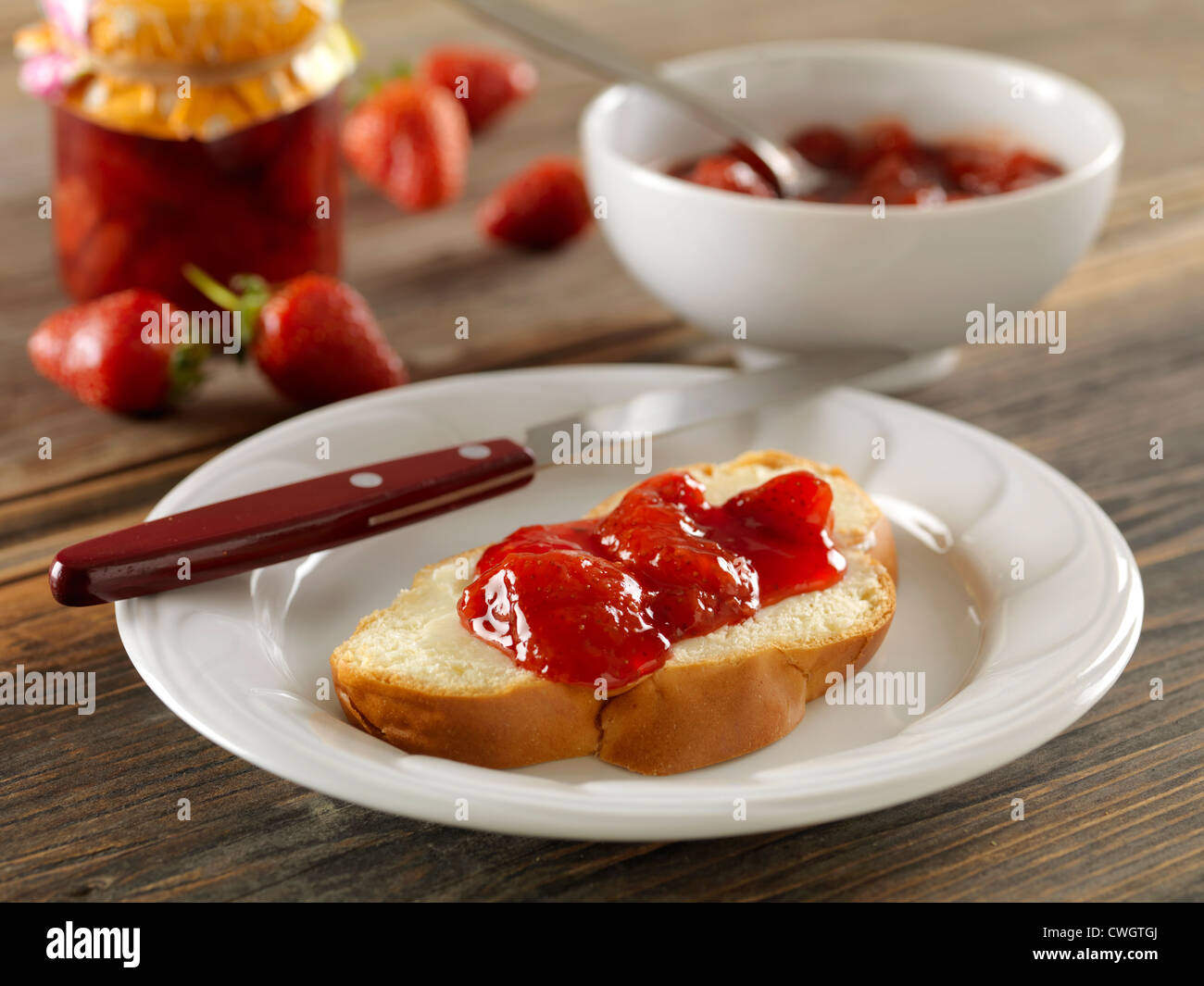 strawberry jelly with scone on white plate Stock Photo