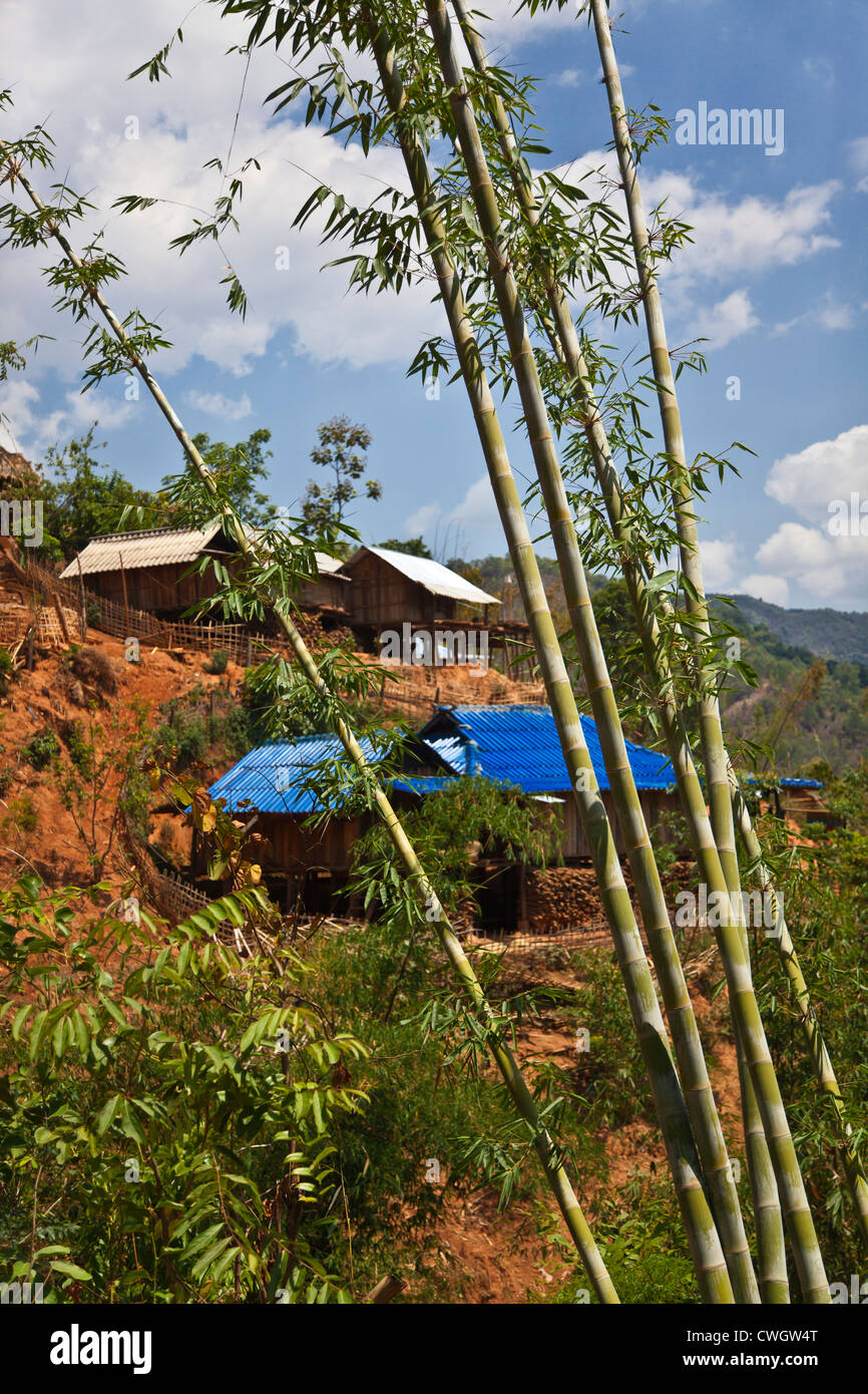 Houses with metal roofs in an ANN TRIBAL VILLAGE near KENGTUNG also known as KYAINGTONG - MYANMAR Stock Photo