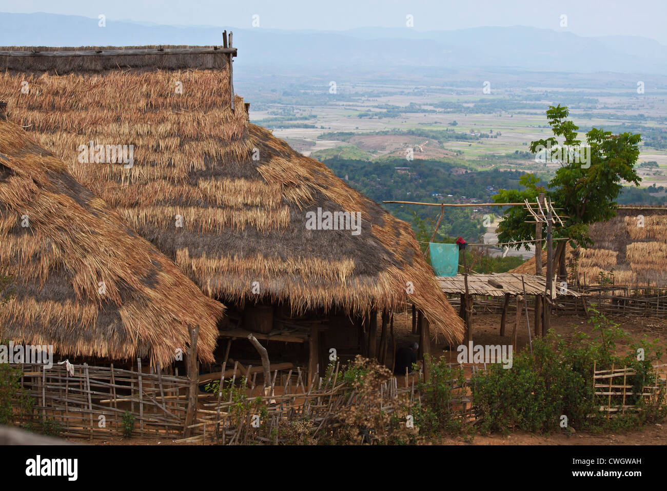 A THATCHED ROOF HOUSE in an AKHA village near KENGTUNG or KYAINGTONG - MYANMAR Stock Photo