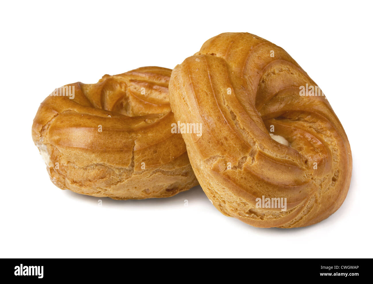 Choux pastry rings filled with whipped cream isolated on white Stock Photo