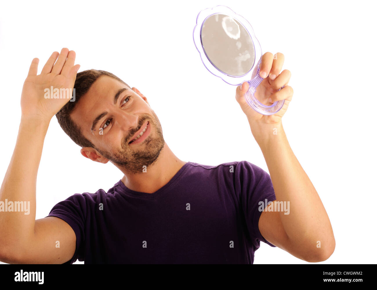 Young man looking in the mirror Stock Photo Alamy