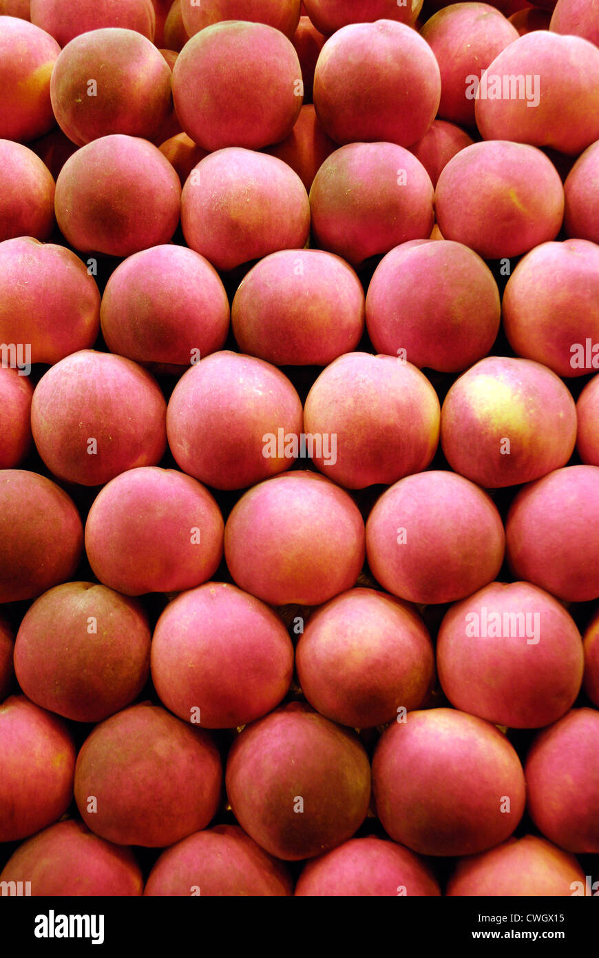Rows of peaches on sale in market Stock Photo Alamy