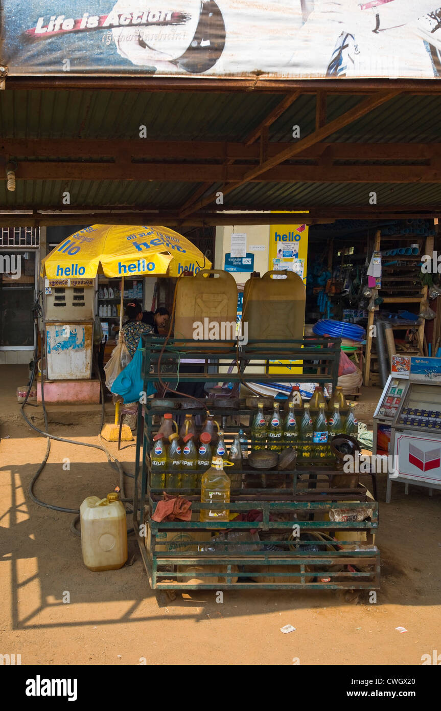 Vertical wide angle view of a typical petrol station or garage selling gasoline in bottles on a street in Cambodia Stock Photo
