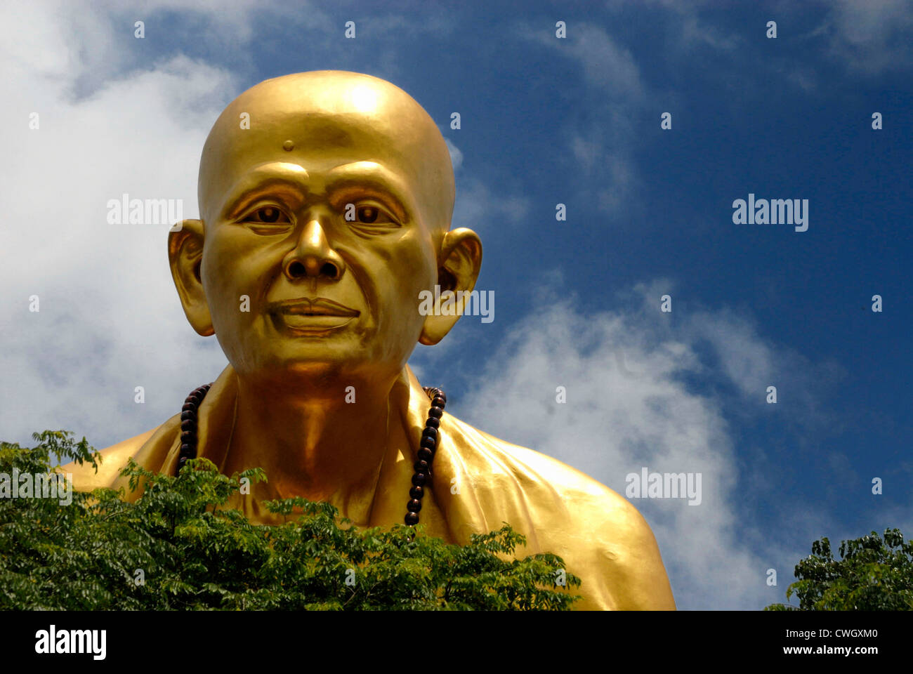 A huge statue of Budha off the international highway overlooking Lamphun on 2/06/2012 in Lamphun Thailand Stock Photo