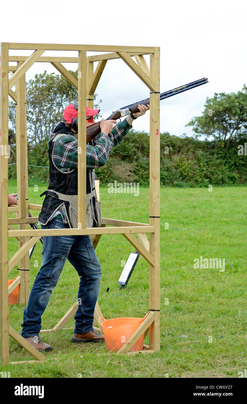 A male competitor in a Clay Pigeon shooting competition at a country