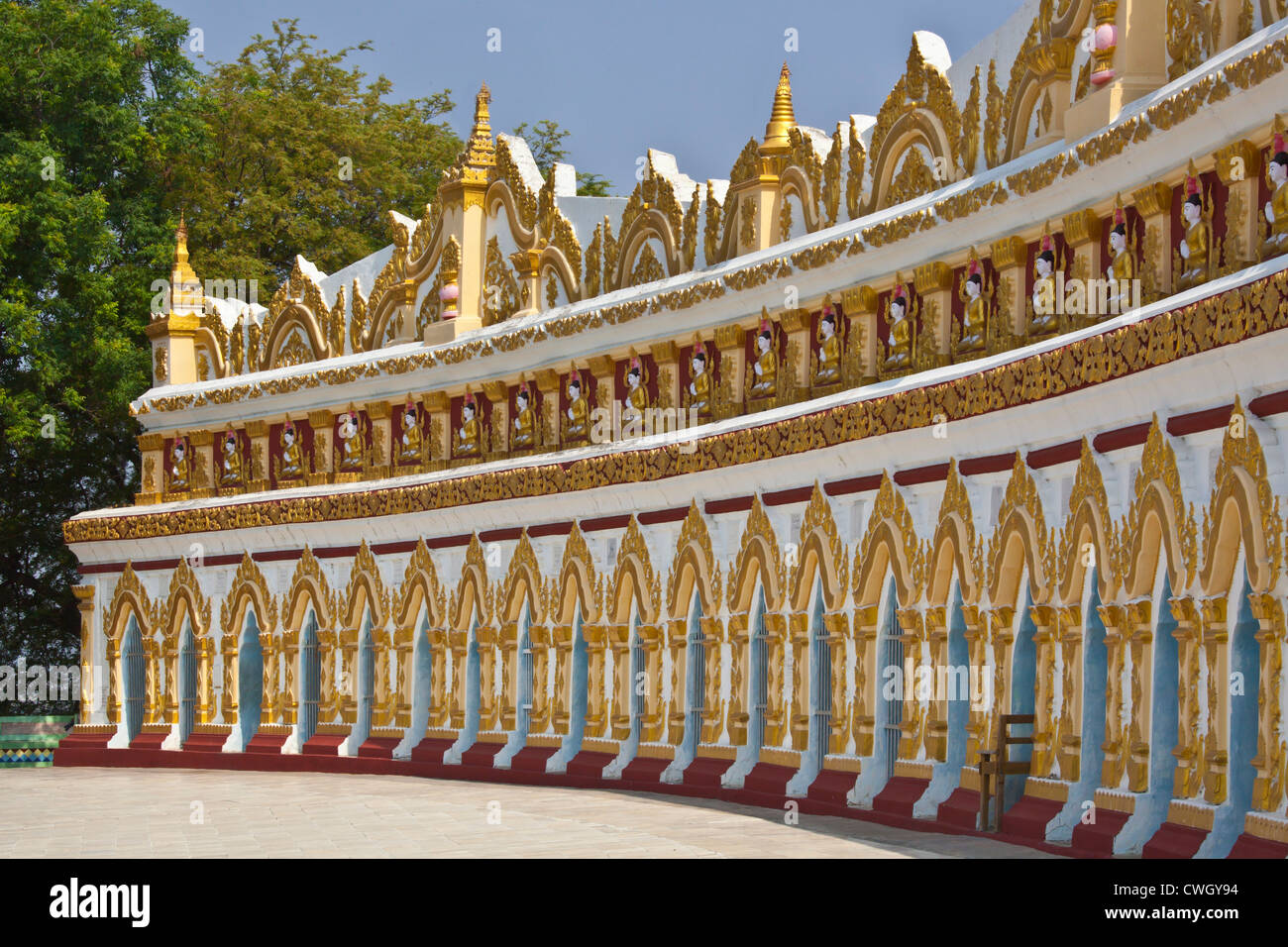 A sculpted exterior of the THIDAGU WORLD BUDDHIST UNIVERSITY is located at the base of SAGAING HILL near MANDALAY - MYANMAR Stock Photo