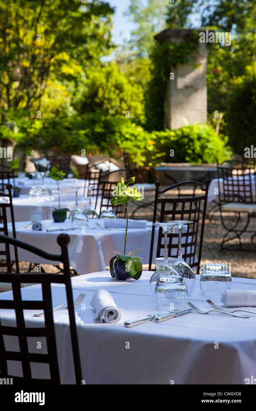 Tables set for dinner at Chateau Roussan near Saint Remy de-Provence France Stock Photo