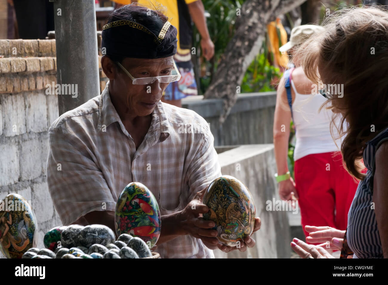 Tourist bartering with vendor in Bali Stock Photo