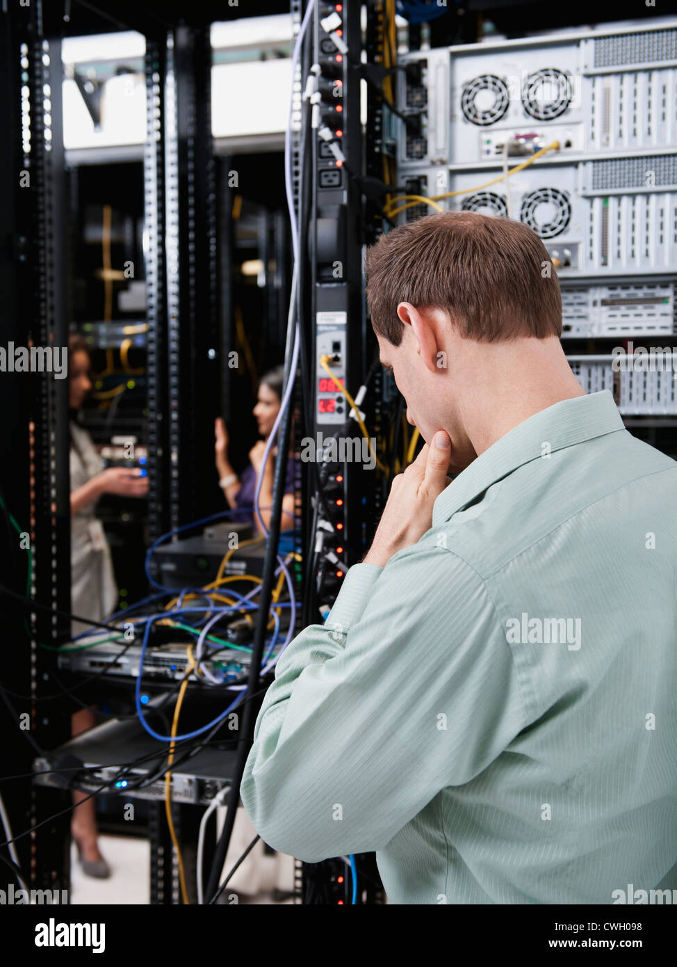 Caucasian businessman working in server room Stock Photo Alamy