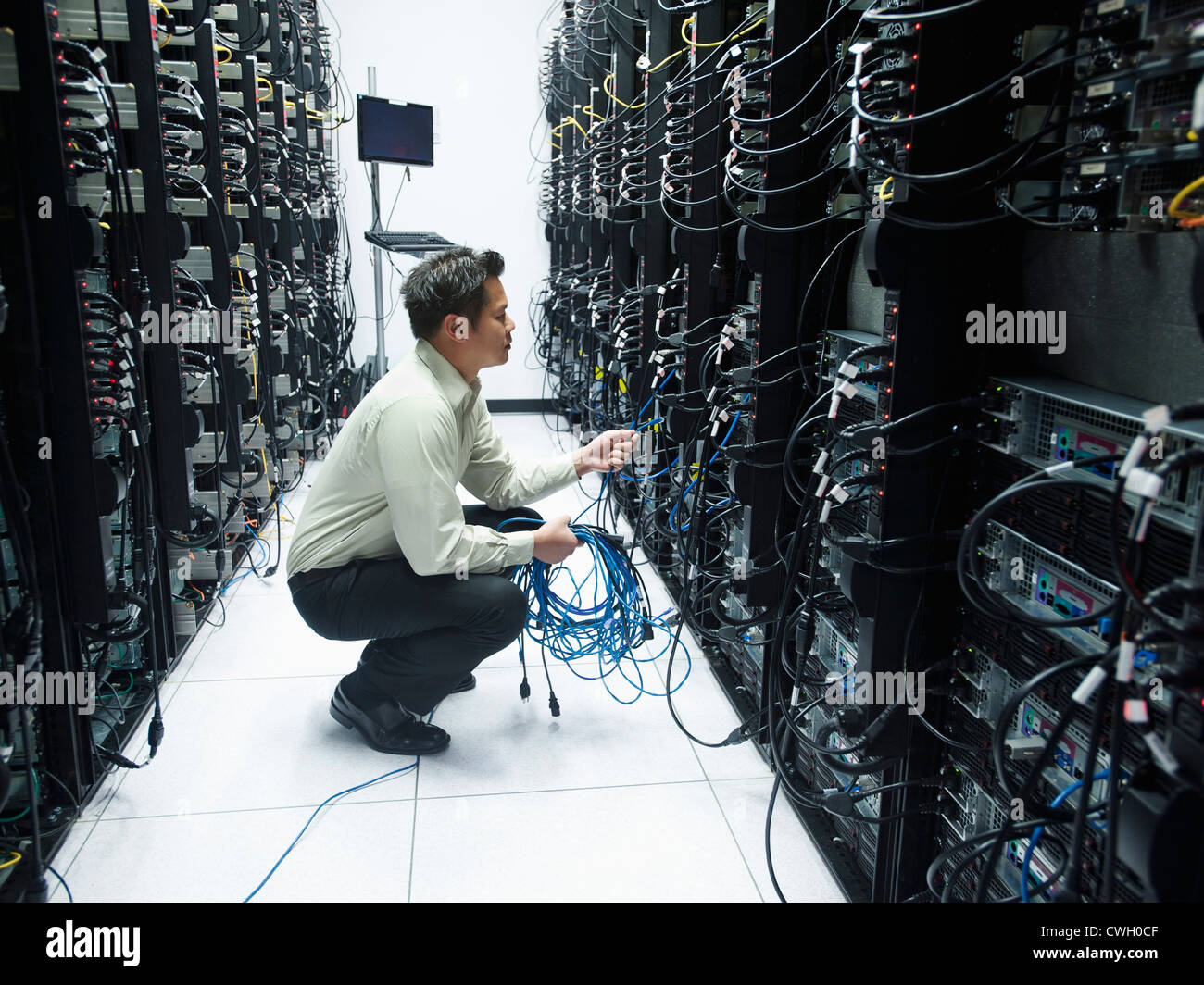 Asian businessman working in server room Stock Photo Alamy