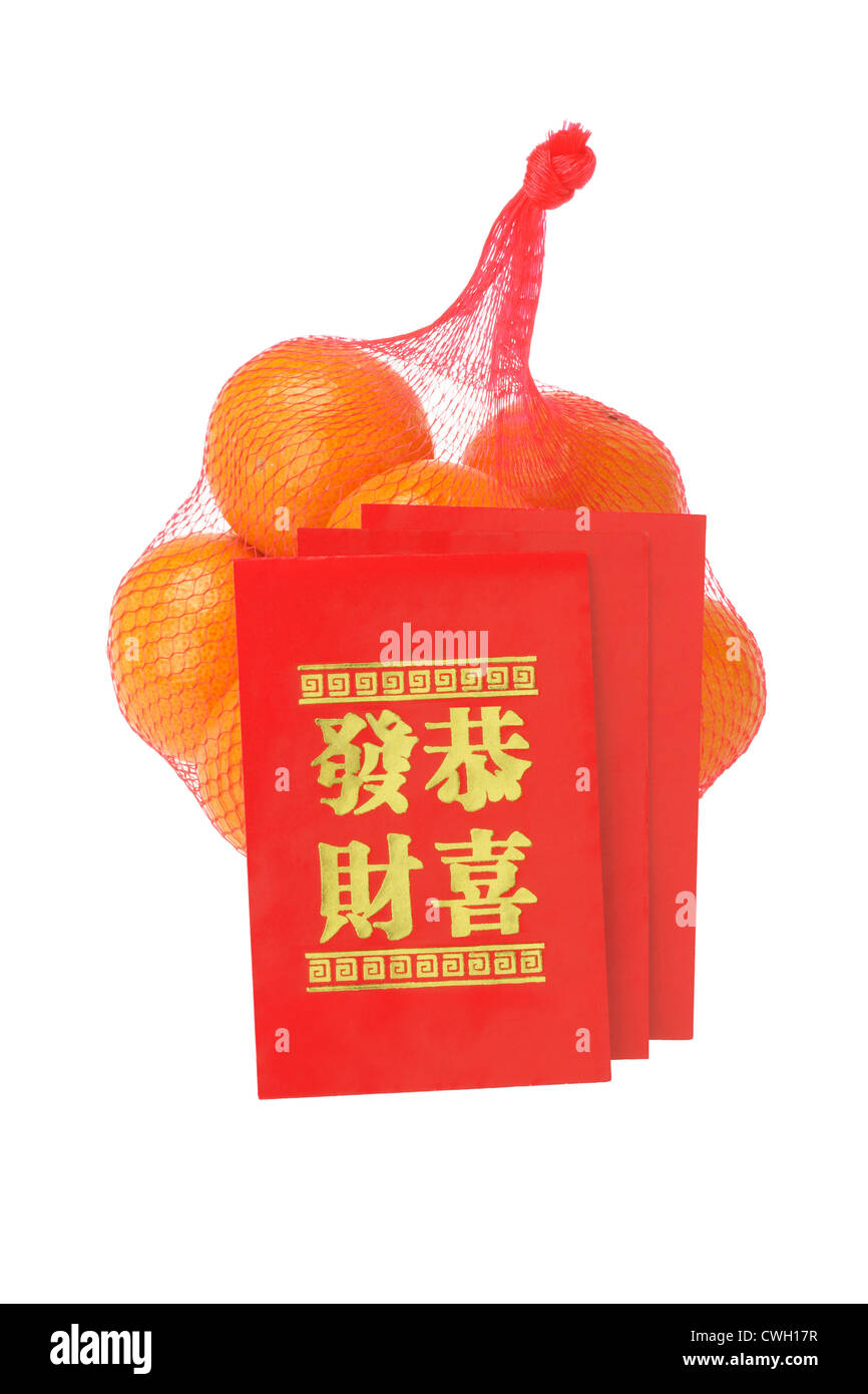 Chinese New Year Red Packets and Oranges on White Background Stock Photo