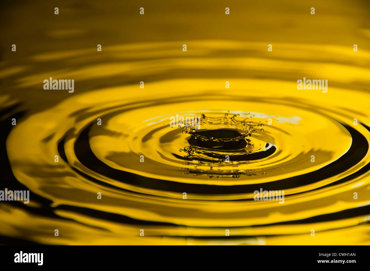 Close-up of water droplet reflected on yellow background Stock Photo ...