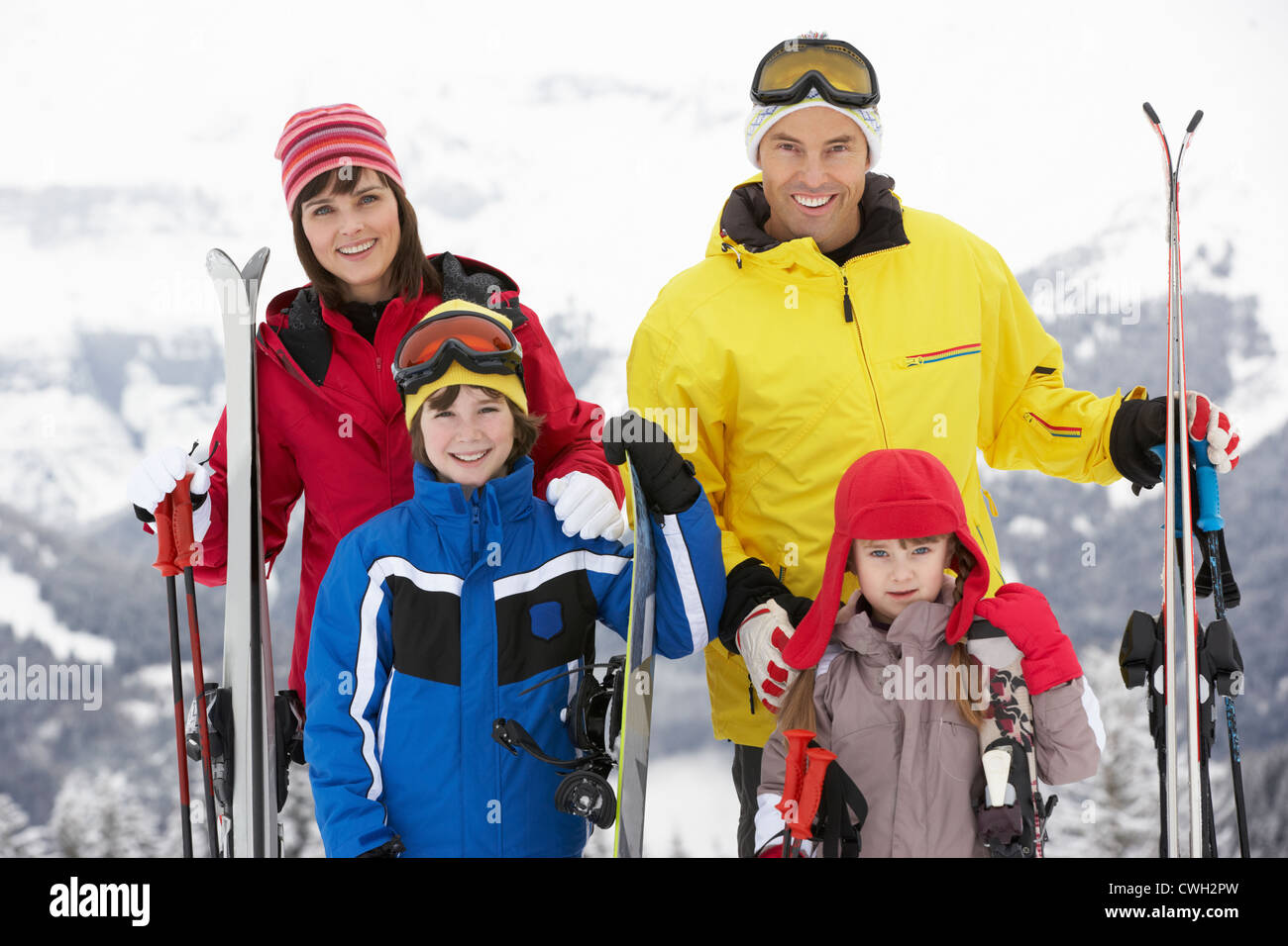 Family On Ski Holiday In Mountains Stock Photo Alamy