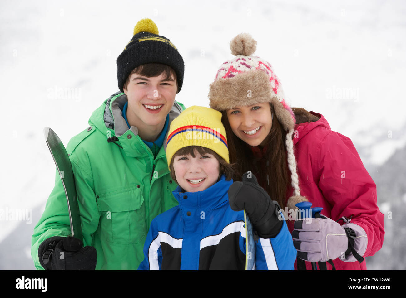 Group Of Children On Ski Holiday In Mountains Stock Photo