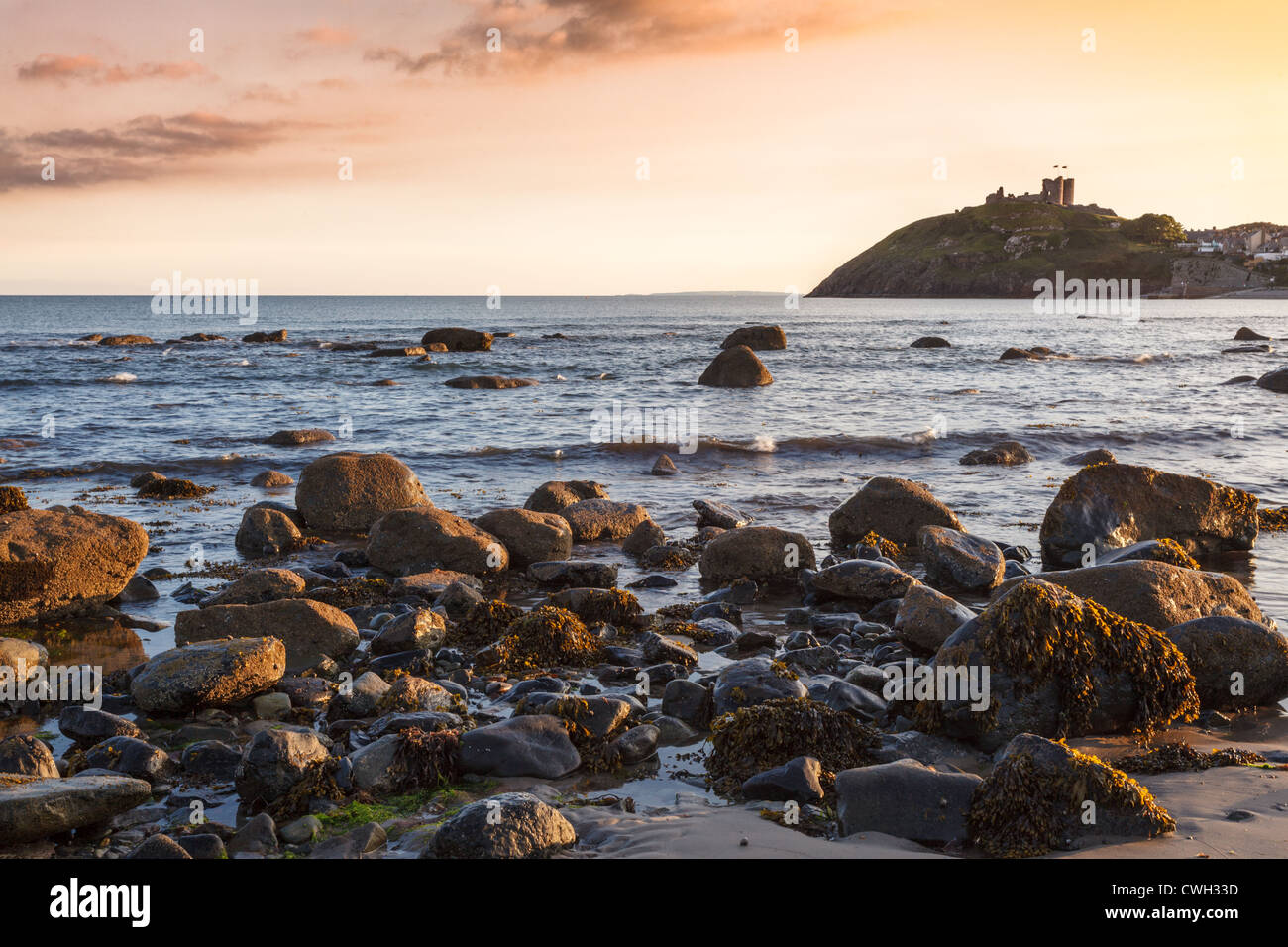 Beach overlooking Crickieth castle in North Wales Stock Photo
