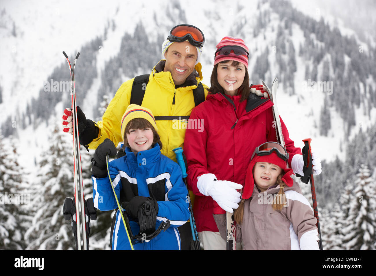 Family On Ski Holiday In Mountains Stock Photo Alamy