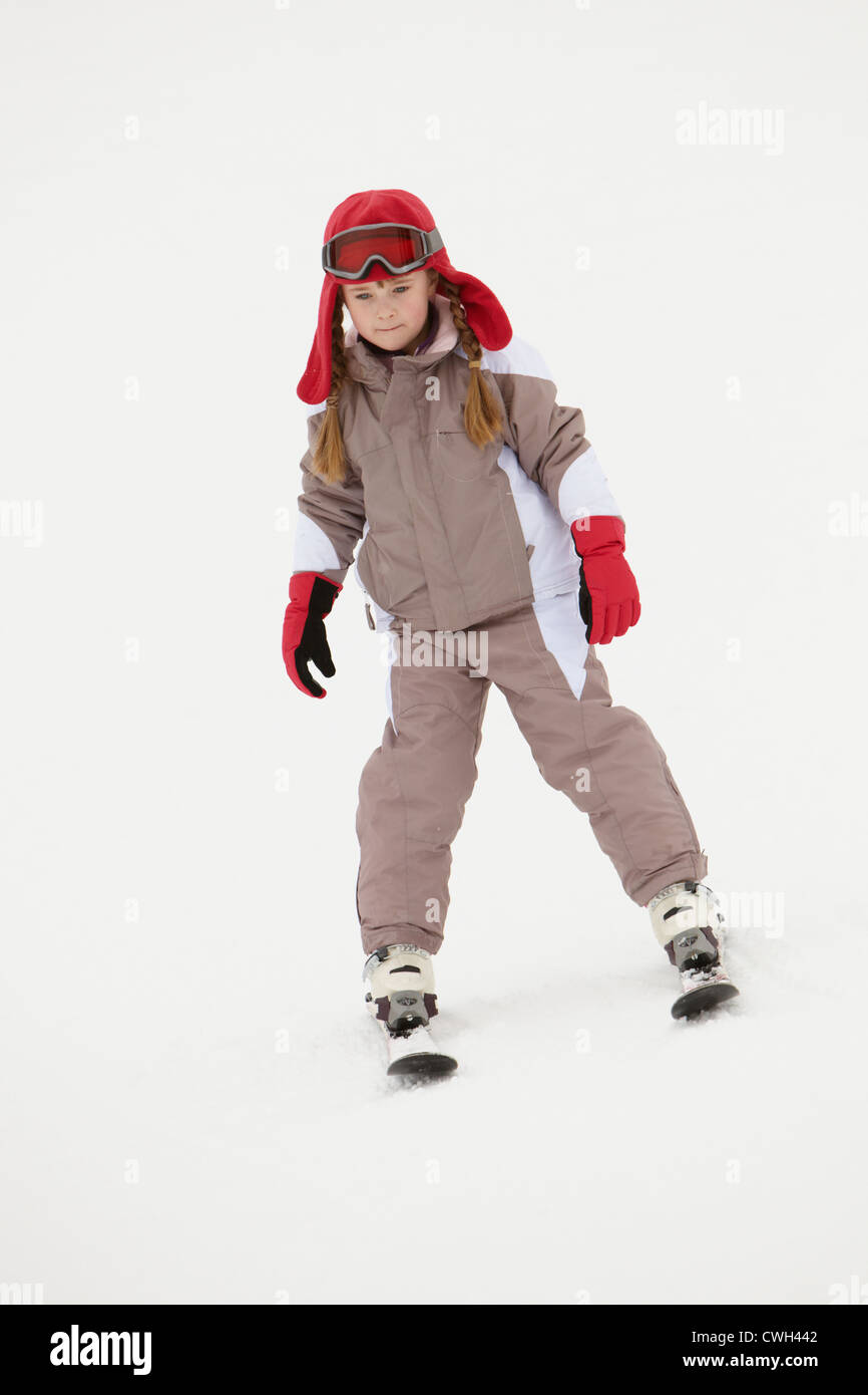 Young Girl Skiing Down Slope On Holiday In Mountains Stock Photo