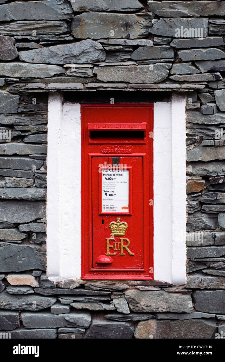 Queen Elizabeth II postbox built into the side of a house wall. Stock Photo