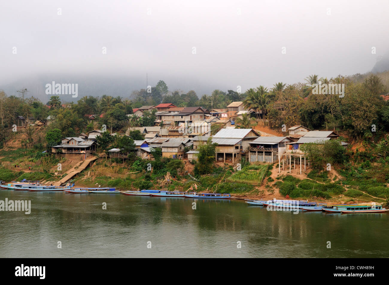 Lao longboats on the Nam Ou River Nong Khiaw  Village Laos Stock Photo