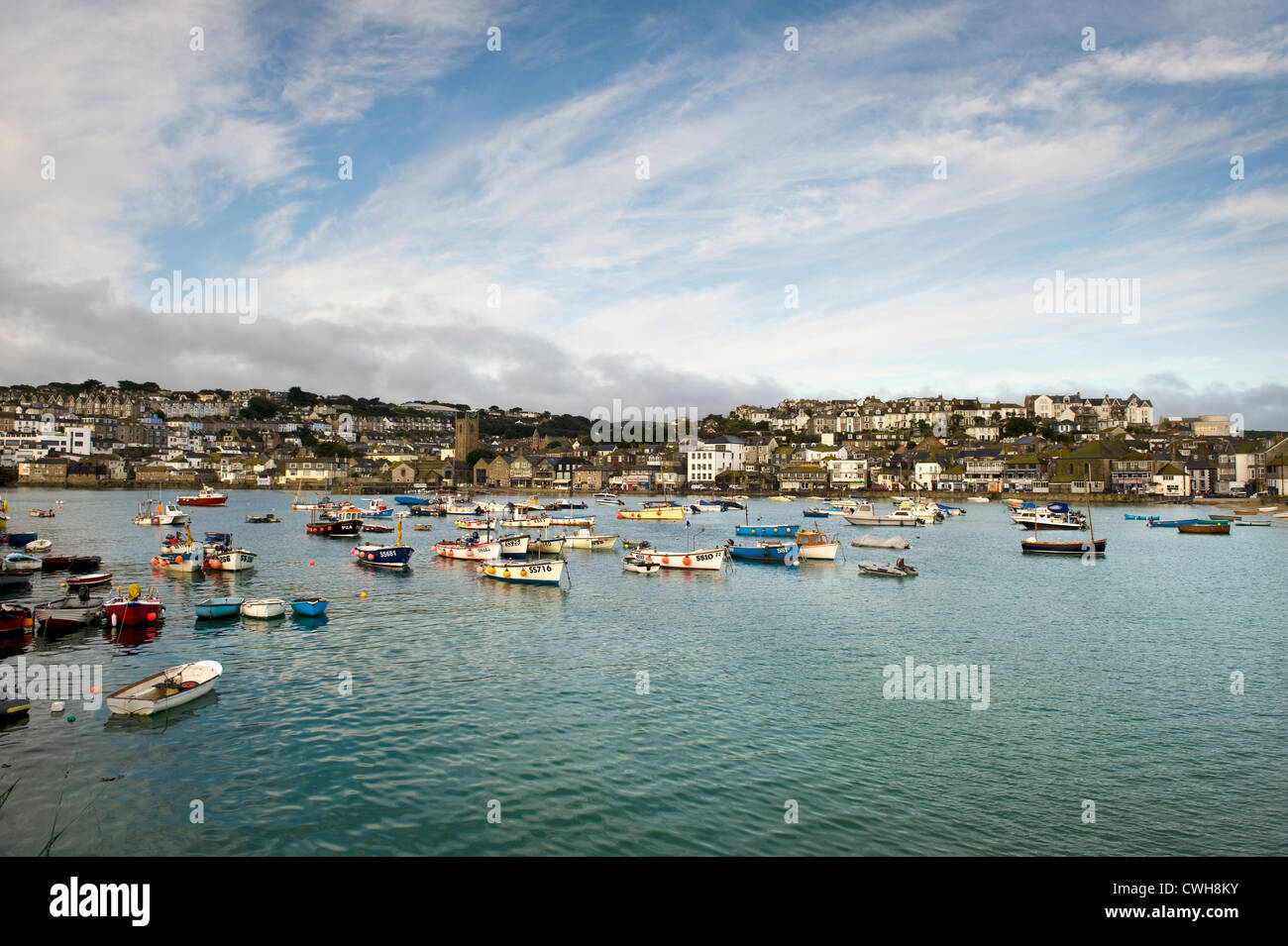 the harbour at st ives cornwall with fishing boats moored at high tide Stock Photo