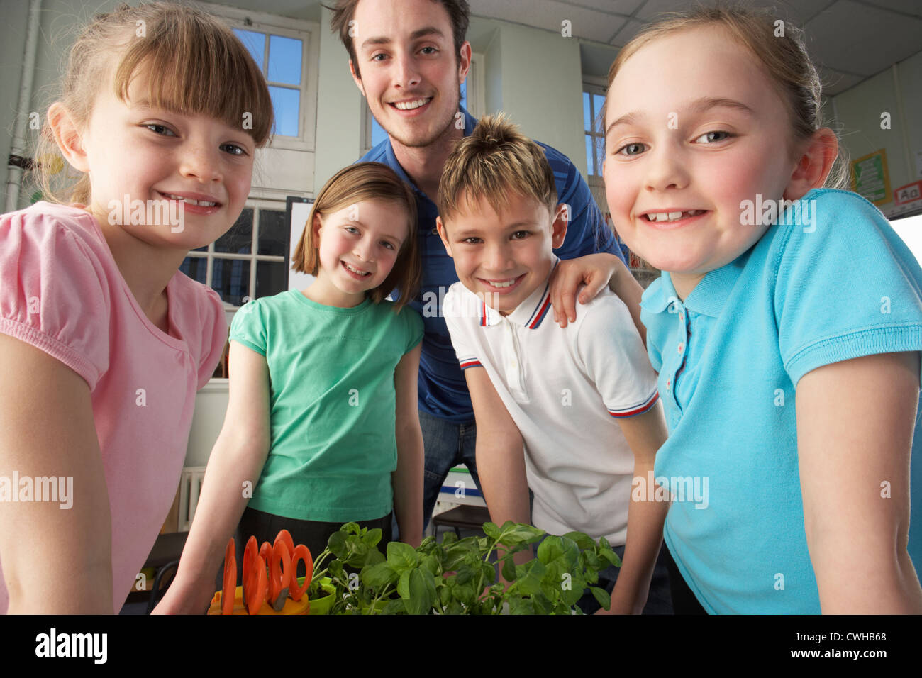 Happy children teacher lesson hi-res stock photography and images - Alamy