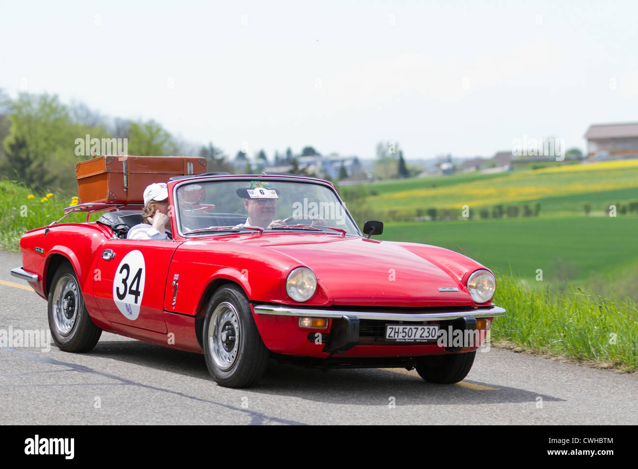 Vintage race touring car Triumph Spitfire MK IV from 1973 at Grand Prix in Mutschellen, SUI on April 29, 2012. Stock Photo