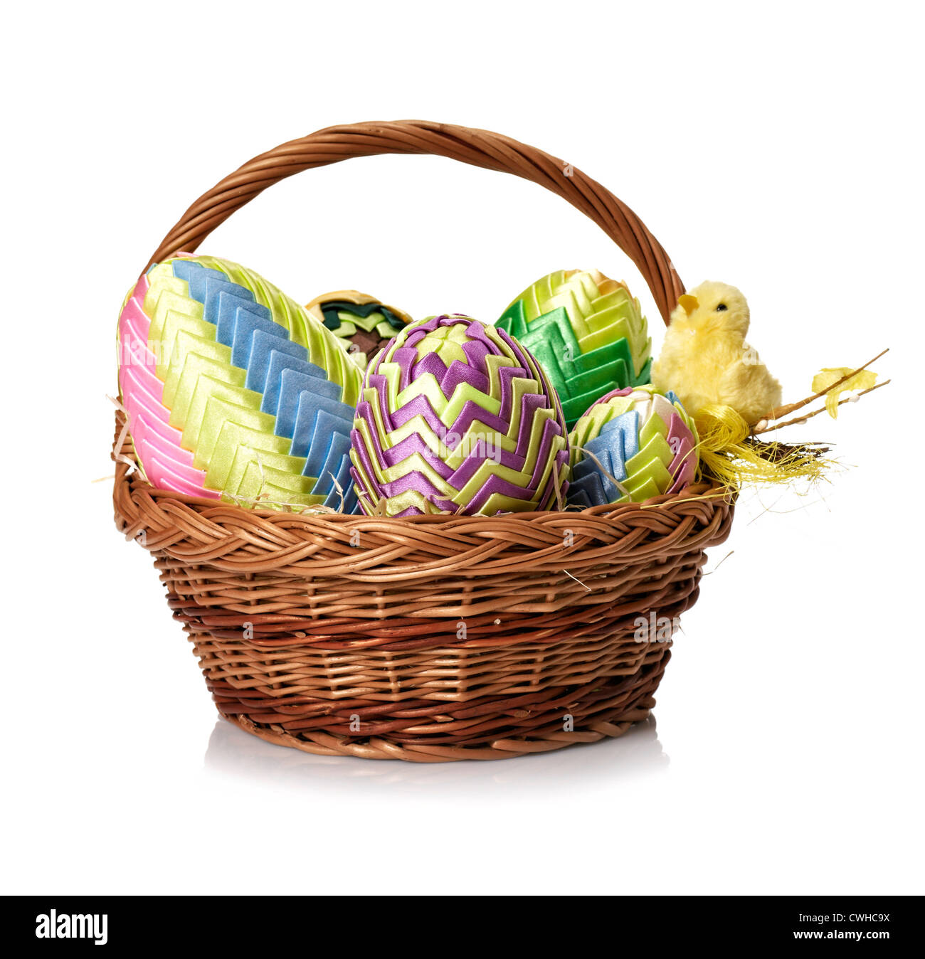 Easter eggs in wicker basket on white background Stock Photo - Alamy