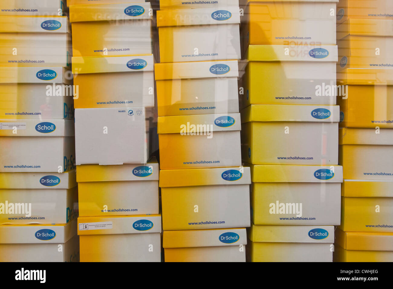 Scholl shoe boxes in a shop window 