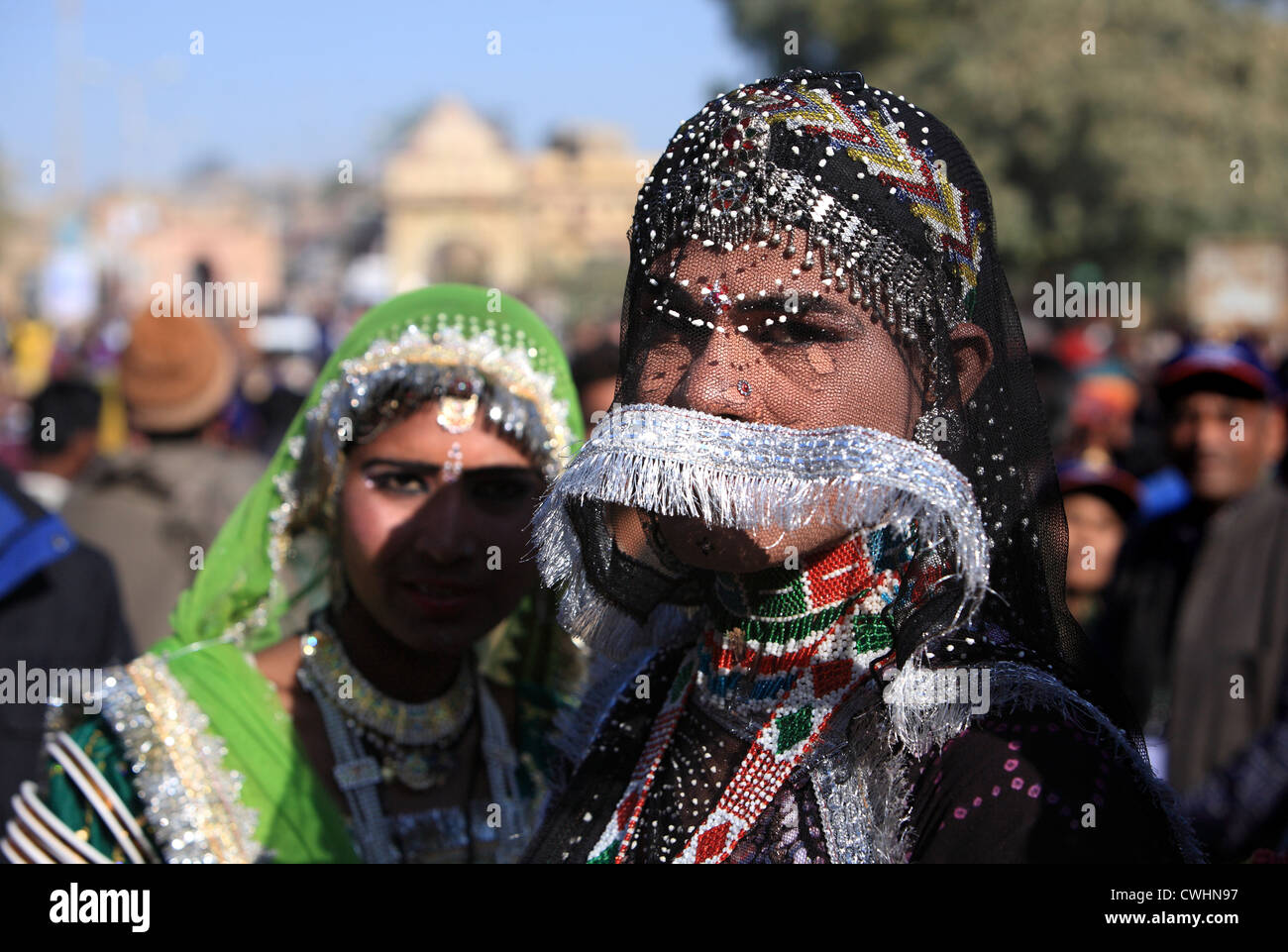 veiled Banjara women waiting for their dance programme at Dessert Festival at Jaisalmer , Rajasthan, India Stock Photo