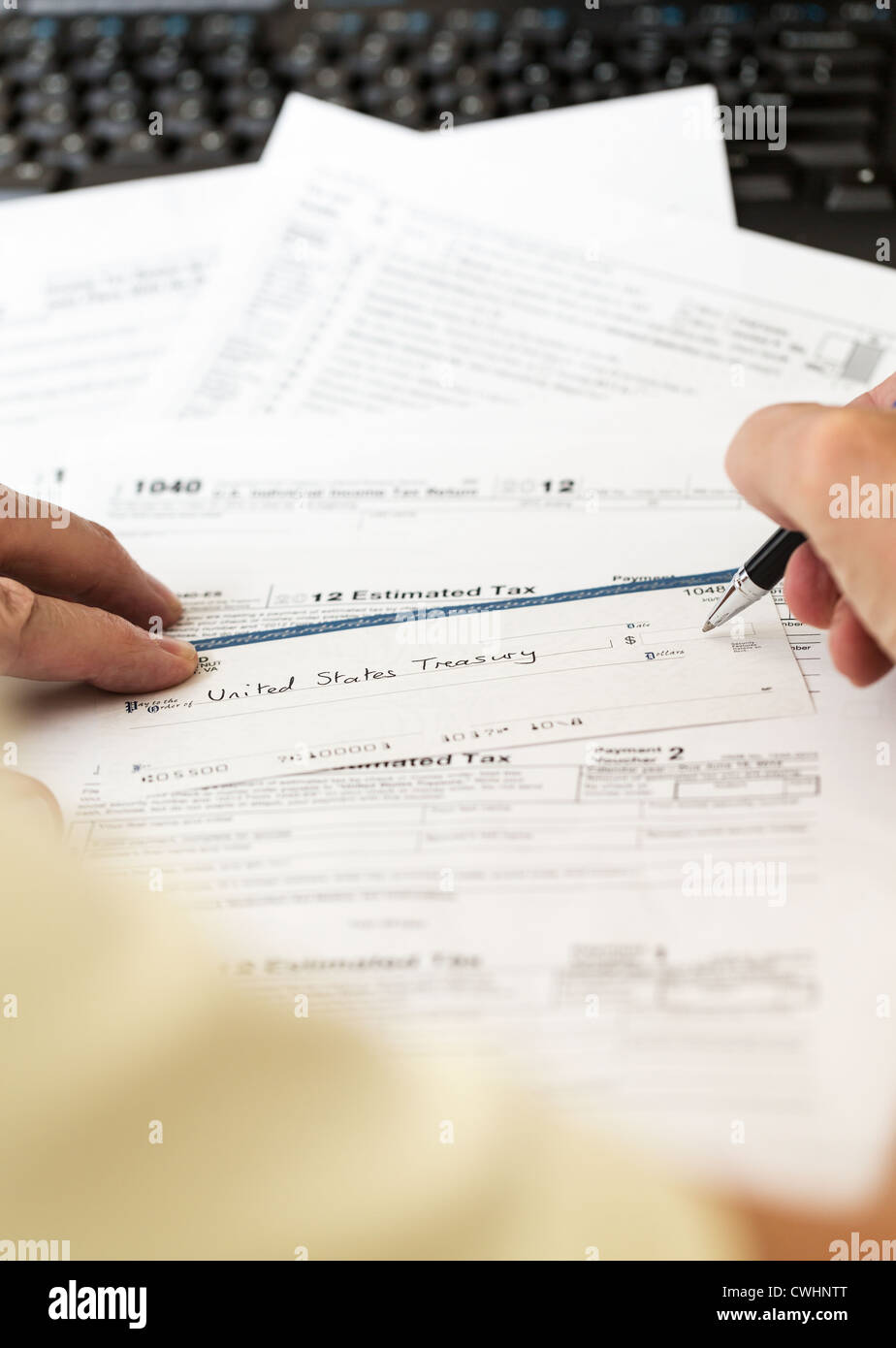 Tax form 1040 for tax year 2012 for US individual tax return with pen and check Stock Photo