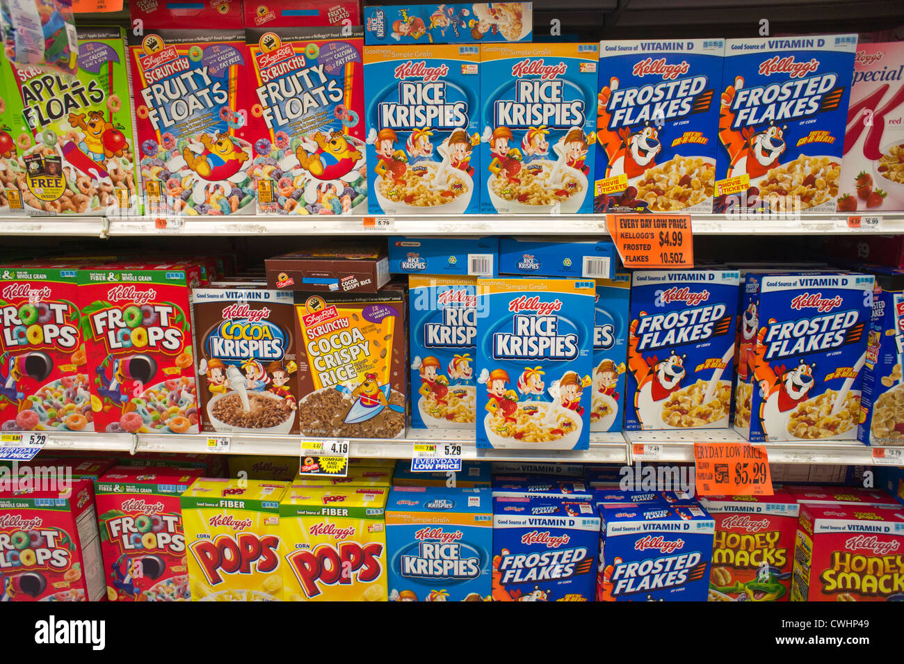 Boxes of Kellogg's breakfast cereals with generic brands mixed in on grocery store shelves in New York Stock Photo