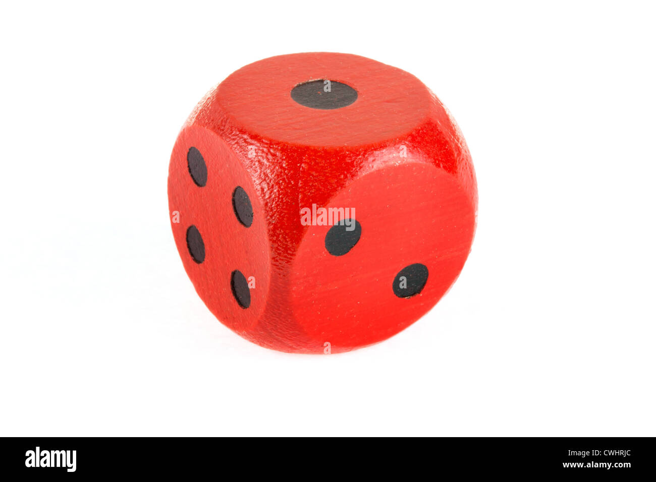 Red wooden die on a white background Stock Photo