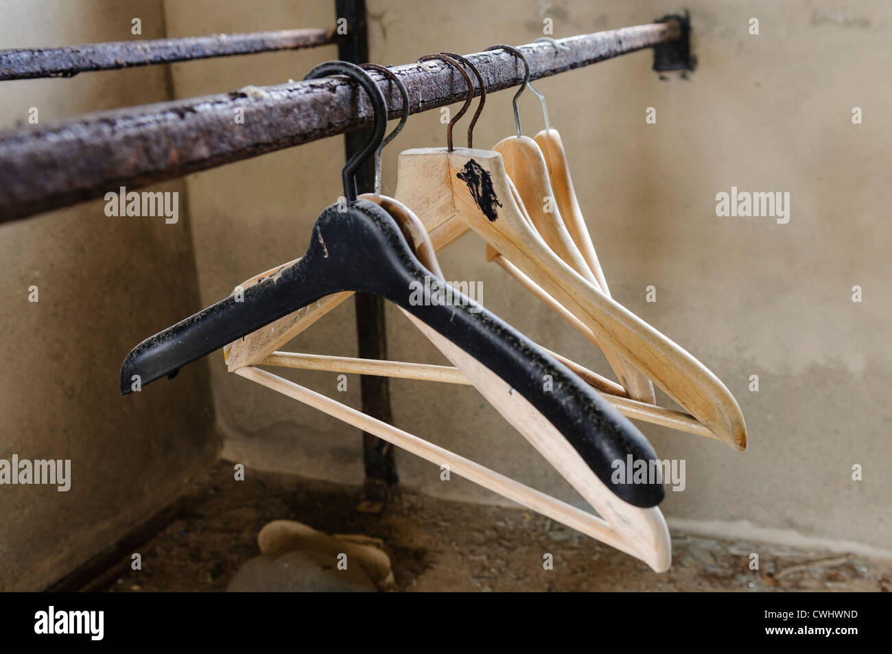 Dirty coat hangers in an abandoned dirty house Stock Photo