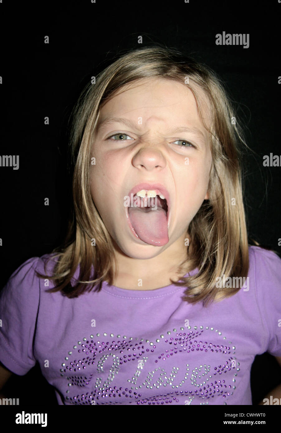 girl,naughty,sticking out tongue,grimace Stock Photo