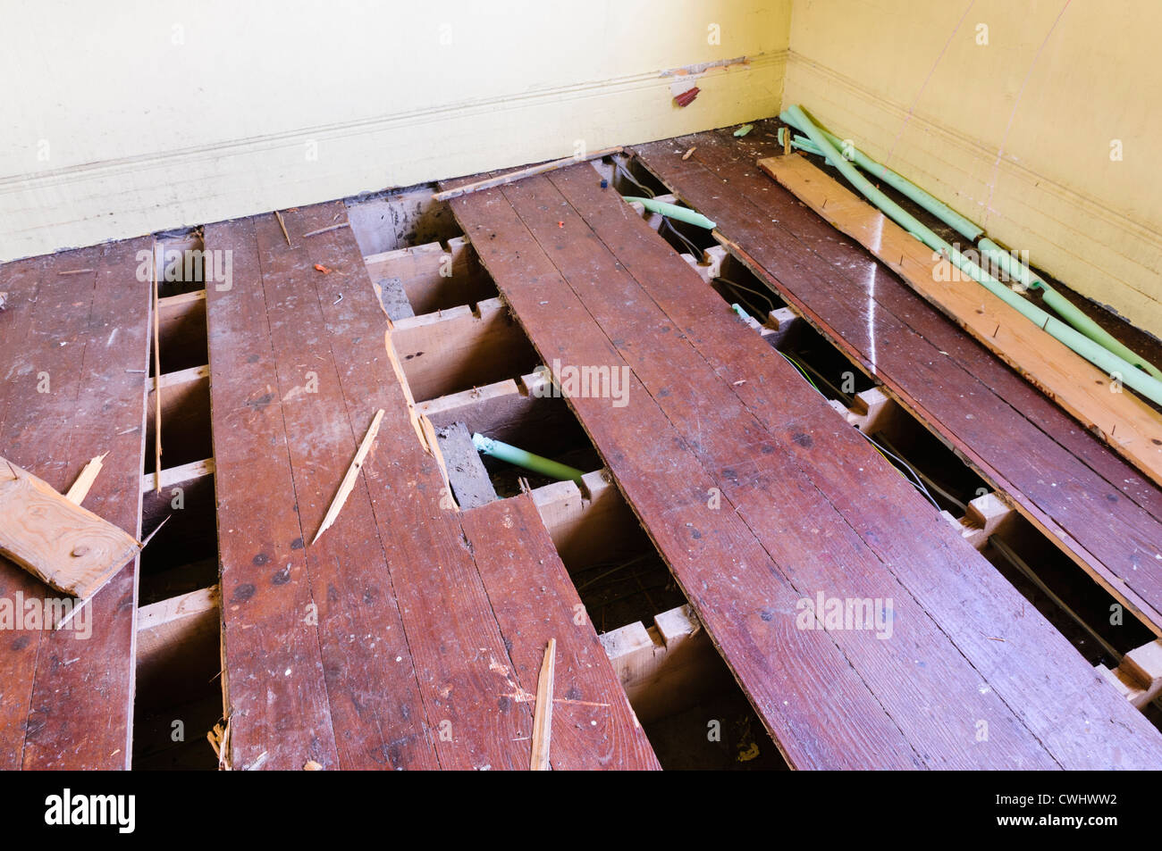 Floorboards lifted by thieves attempting to steal copper heating pipes