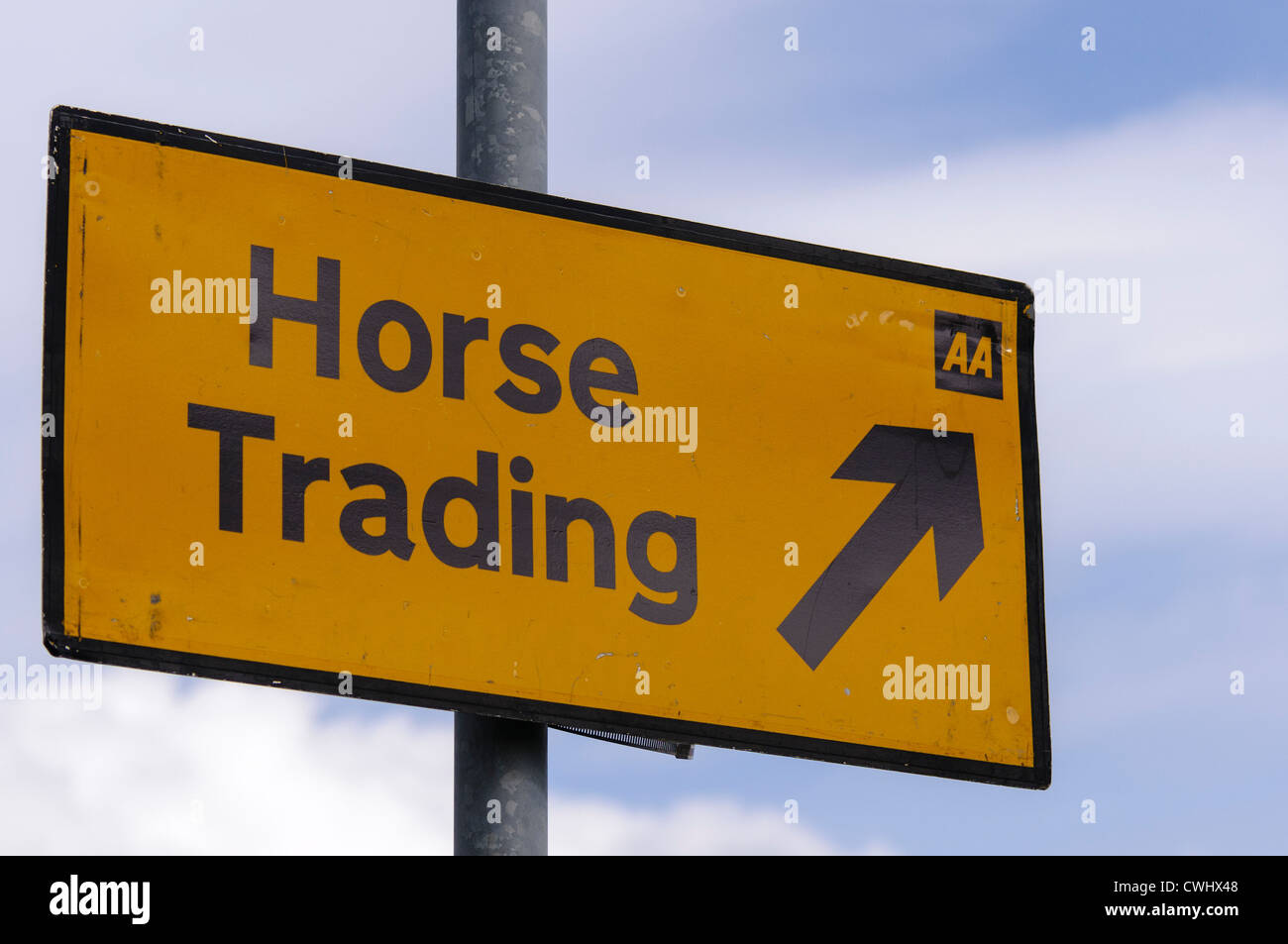 AA Street sign giving directions to horse trading area Stock Photo