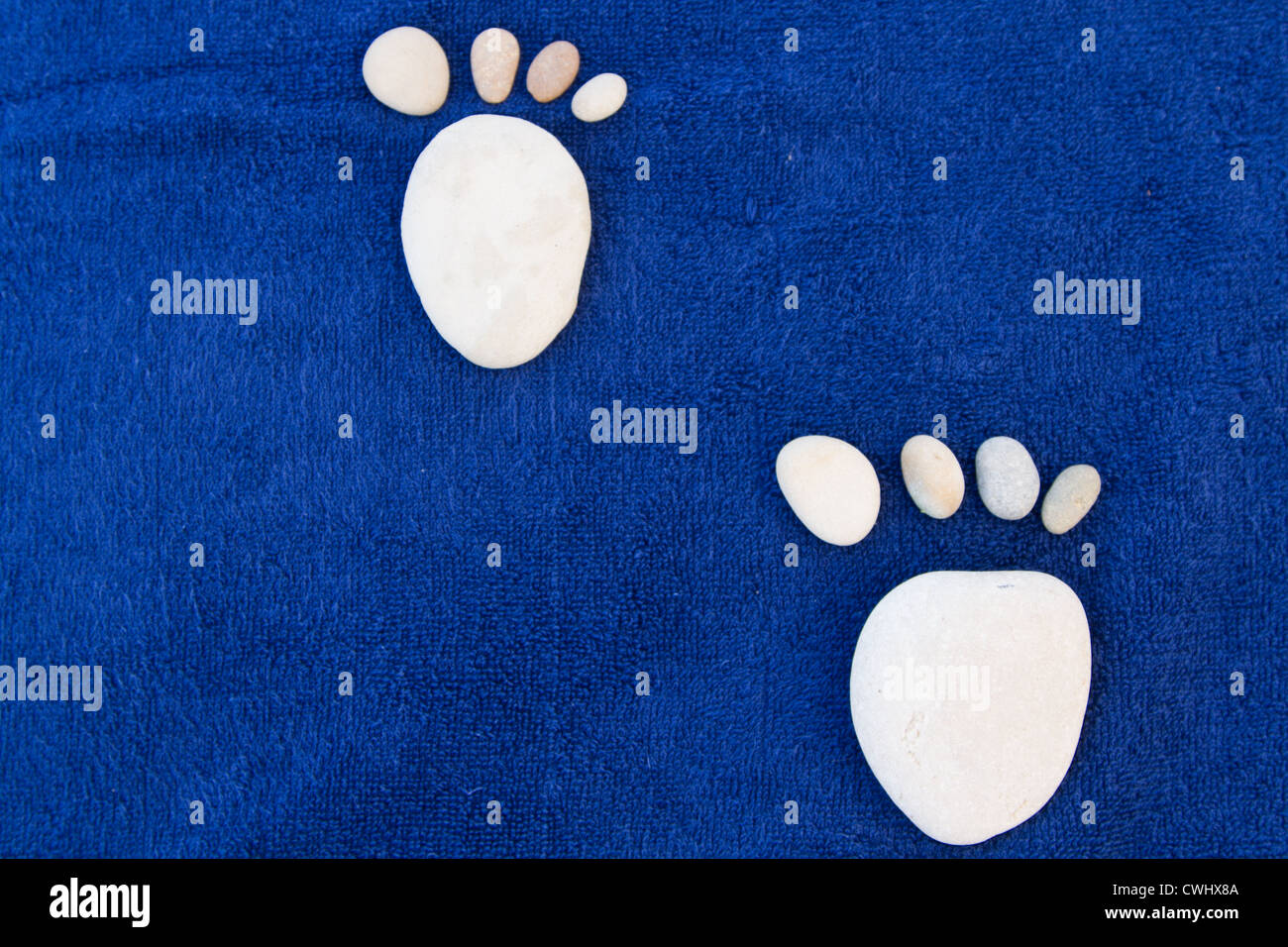 Two Feet Maked By Stones Stock Photo Alamy