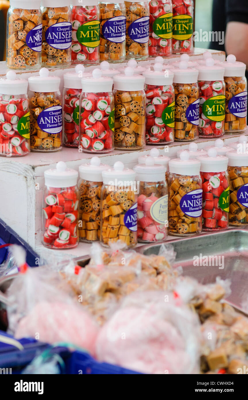 Jars of traditional hard boiled sweets on sale on a market stall Stock Photo