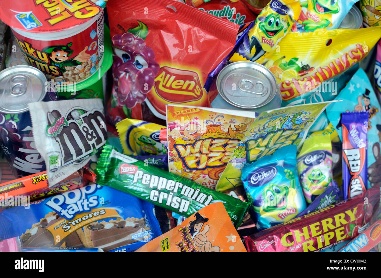 Potentially unhealthy confectionery and soft drink products Stock Photo