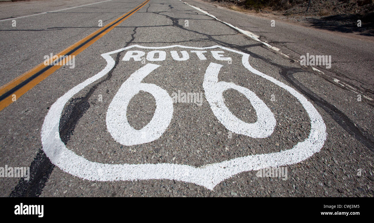 An old Route 66 shield painted on road in United States of America Stock Photo