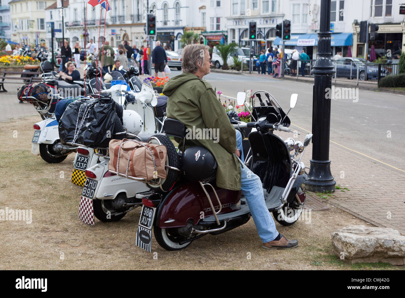 Man sitting on classic scooter at the International Scooter Rally Isle of  Wight England UK Stock Photo - Alamy
