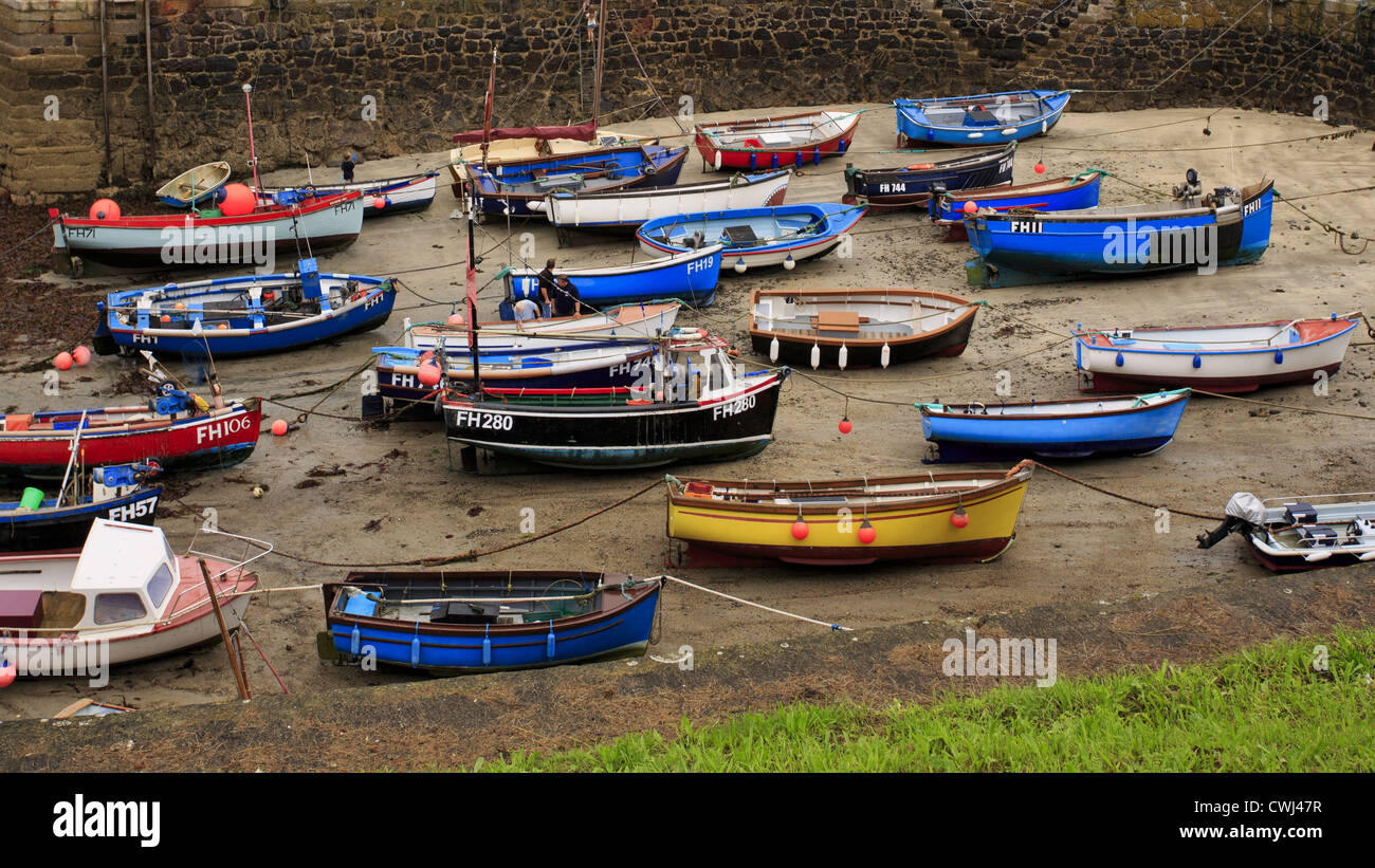 Low tide in the harbor with fishing trawlers Stock Photo - Alamy