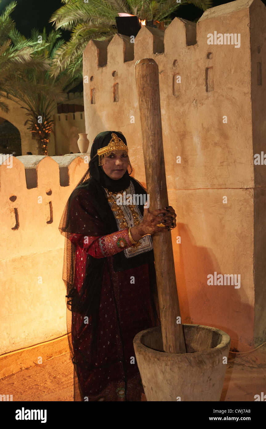 Elk207-1454v Oman, Muscat, Muscat Festival, women's traditional work, pounding grain Stock Photo