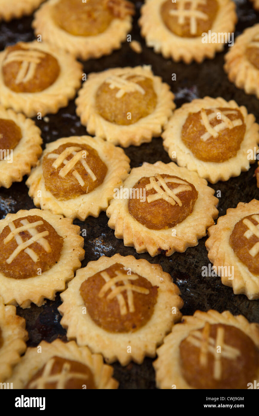 Pineapple tarts are small, bite-size pastries filled with or topped with pineapple jam, popular in Singapore and Malaysia Stock Photo