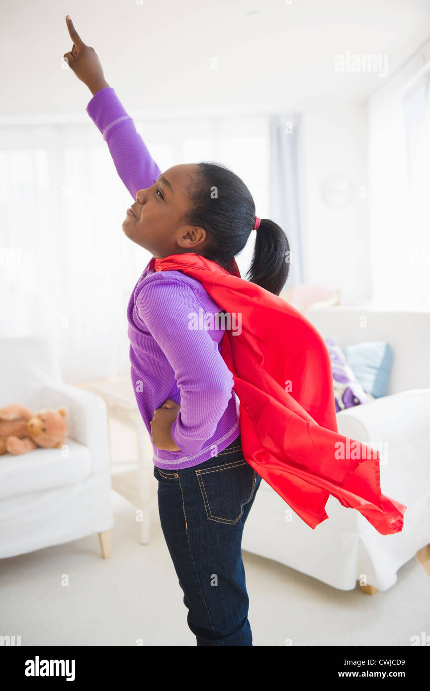 Black girl pretending to be a superhero Stock Photo