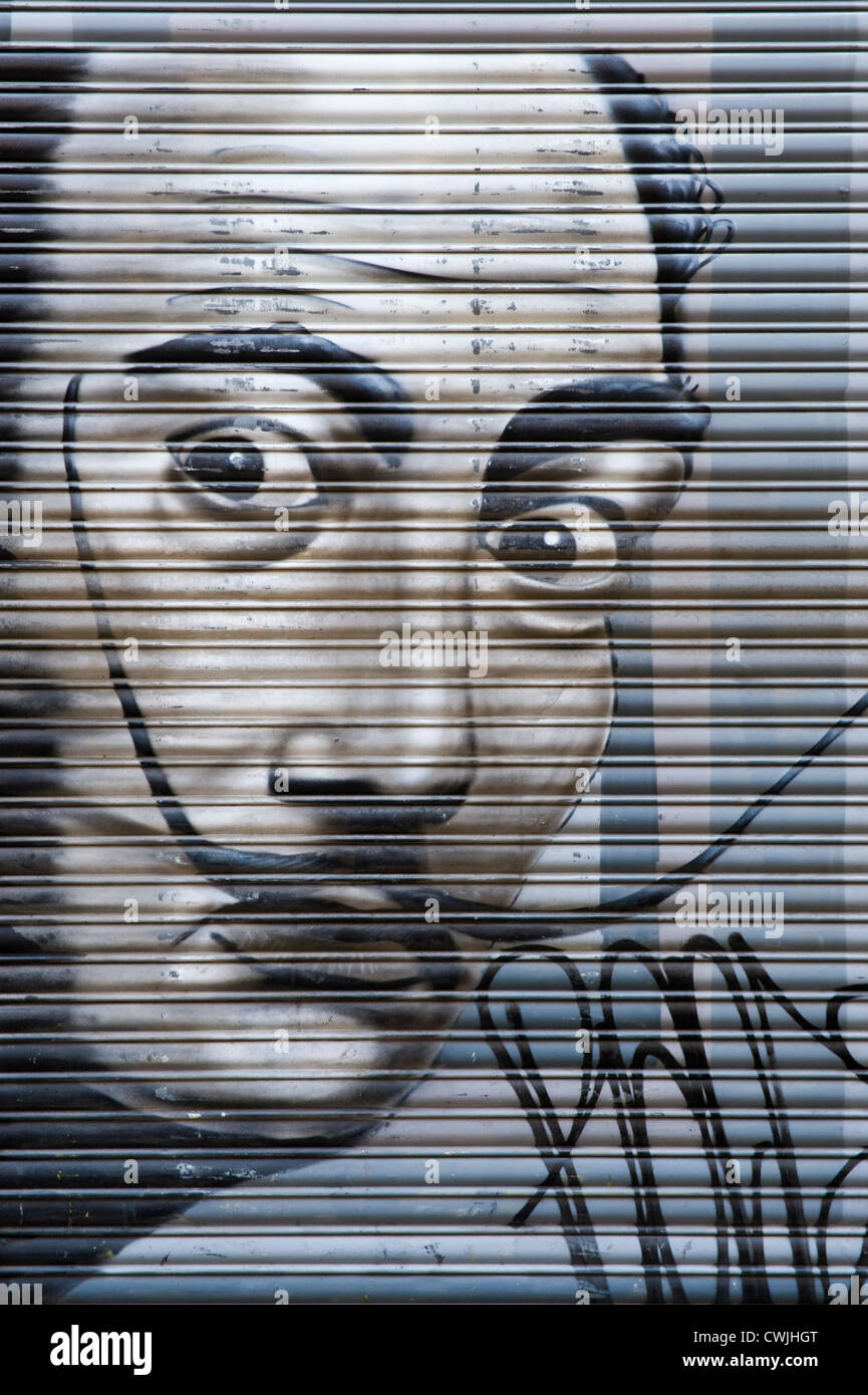 Salvador Dali graffiti on roller security shutter of shop in Barcelona, Catalonia, Spain, ES Stock Photo