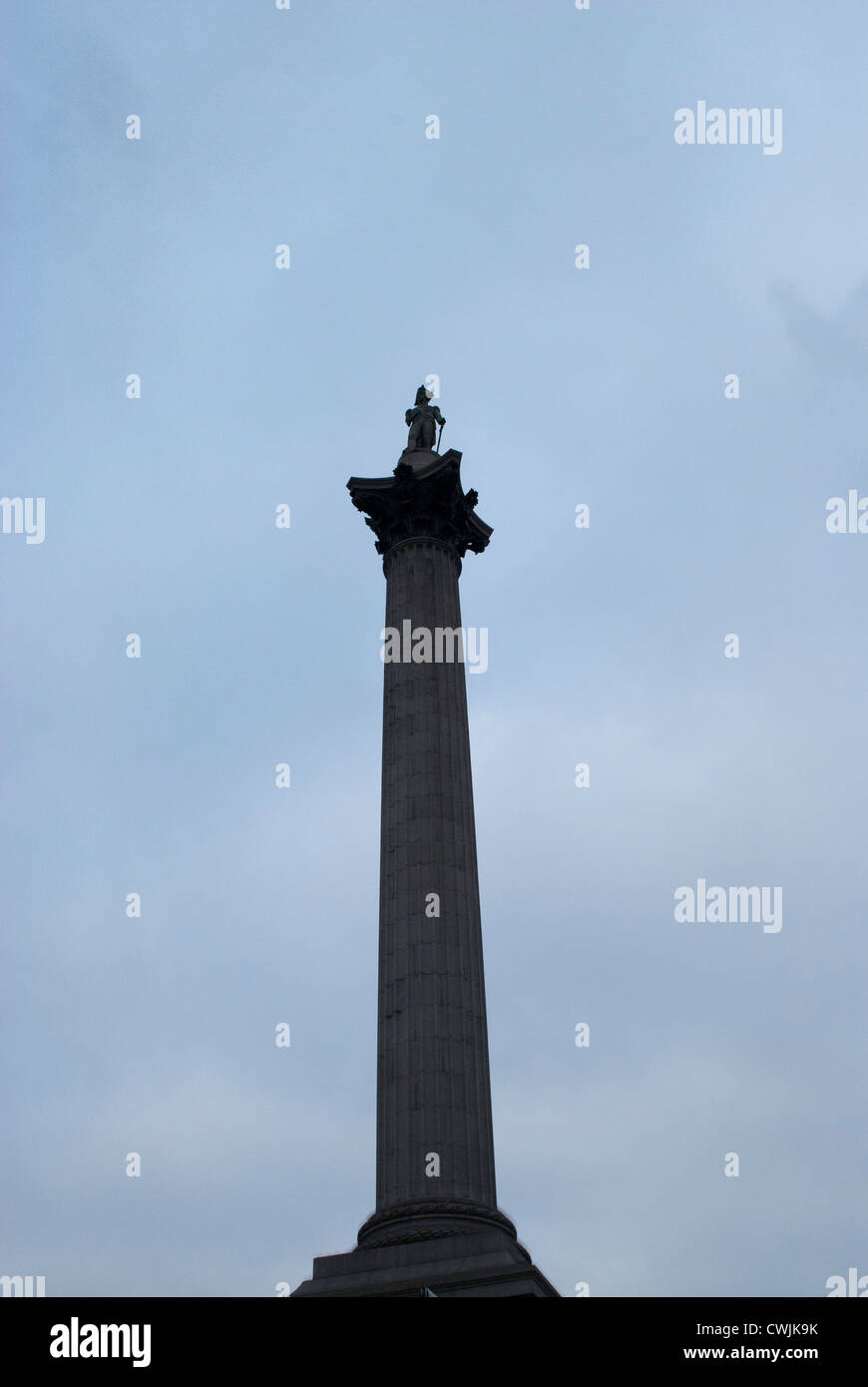 Looking up at Nelson's Column against a cloudy sky Stock Photo